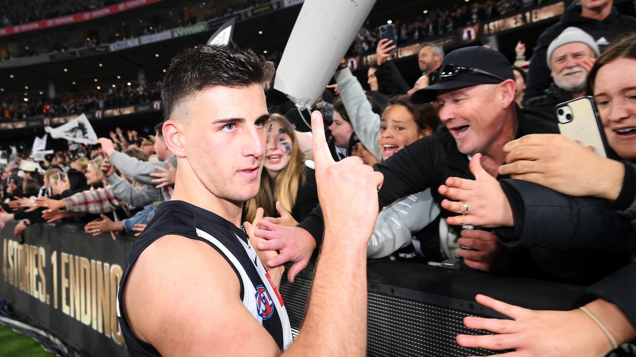 Nick Daicos of the Magpies celebrates victory in a jam-packed MCG. (Photo by Quinn Rooney/Getty Images)