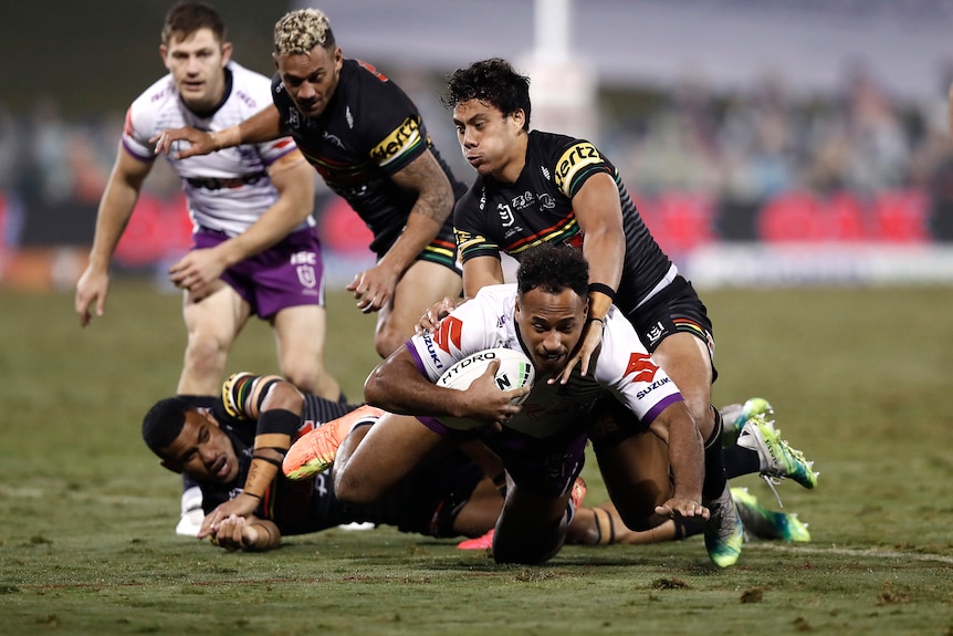 A man is tackled during a rugby league match
