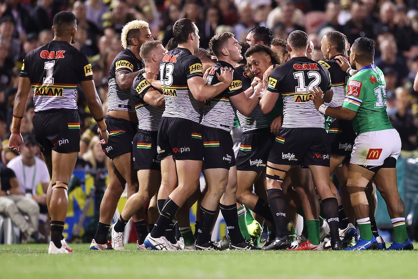 Two rugby league teams engage in a scuffle