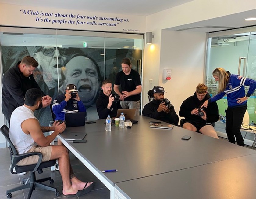 NRL chief photographer Grant Trouville takes Bulldogs players through some tips and techniques during the off-season.